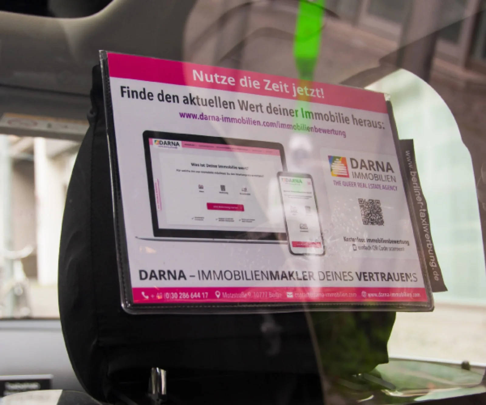 Darna Immobilien headrest ad with QR code